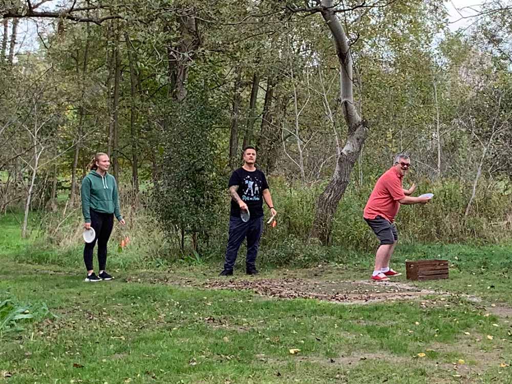 Haley, Sean S. and Todd playing disc golf